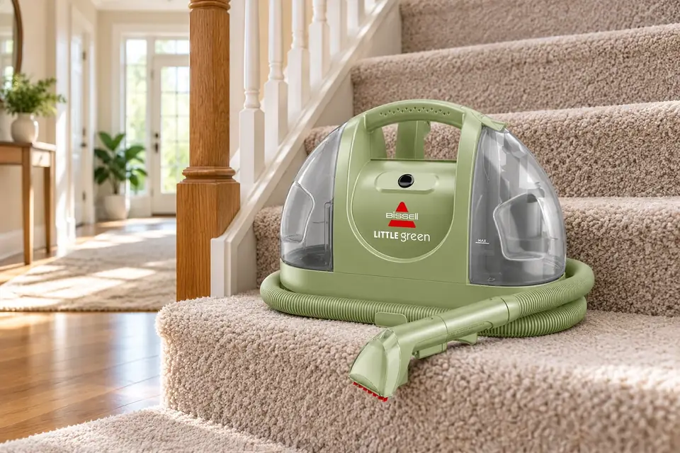 The Bissell Little Green 1400B at work: a portable carpet cleaner on a carpeted staircase